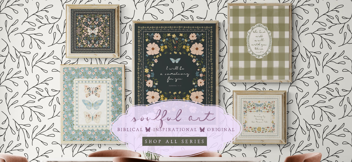 Amylee Weeks homepage banner showcasing a collection of Cottagecore Christian wall art prints, featuring the dark floral 'I Will Be a Sanctuary' print and the olive green 'The Lord Will Walk With You' buffalo check print, arranged over black and white botanical wallpaper.